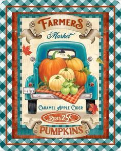 an old blue truck with pumpkins on the front and plaid table cloth behind it