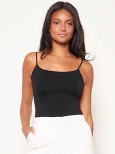 This versatile seamless camisole can be worn under almost anything to ensure a smooth shape. This basic seamless camisole is a lifesaver for all your fashion needs. It's perfect for day wear or evening wear and can be layered with tops or worn alone, or act as a basic foundation for sheer tops and blouses. It's crafted from the softest of materials so you'll love how it feels against your skin. The snug fit smoothes back and waist for an elegant look. Fabric & Care 98% Nylon, 2% Spandex Sizing O Sheer Tops, Colorado Outfits, Curvy Swimwear, Tops And Blouses, Black Camisole, Weekly Outfits, Curvy Dress, Romper Dress, Sheer Top