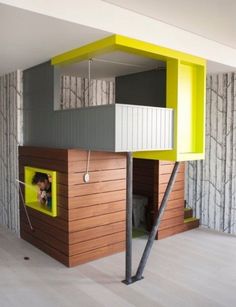 there is a loft bed in the middle of this room with yellow and gray walls