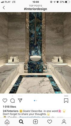 the bathroom is decorated in blue and white marbles, with two sinks on each side