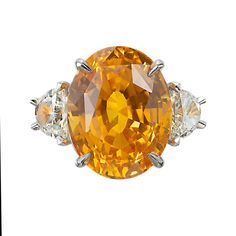 For Sale on 1stDibs - Orange and yellow oval sapphire and half moon diamond cocktail ring. GIA certified center oval center stone in a 18k yellow gold hand made setting with Half Moon Diamond, Family Ring, Family Rings, Diamond Cocktail Ring, Diamond Cocktail Rings, Orange Sapphire, Gold Hand, Jewelry Designers, Orange And Yellow