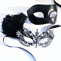 Couples masquerade masks, black feather, women metal mask and Venetian men mask Women black mask studded with black onyx rhinestones that give a hint of metallic shade. This mask has black with feathers with black/gold crystal brooch. Men's mask is a simple black base with a comfortable fit. S H I P P I N G - Processed same day or within 24 hours. 1-2 day guaranteed delivery services offered, add items to cart and click on shipping tab for rates. Please leave a check out note with your need date Black Feathered Masquerade Mask For Costume Party, Black Masks And Prosthetics For Mardi Gras Masquerade, Black Masks For Mardi Gras Masquerade, Black Eye Mask For Masquerade, Black Feathered Masquerade Mask, Black Masks For Halloween Gift, Black Halloween Masks As Gifts, Black Eye Mask For Carnival, Black Masquerade Mask For Halloween Gift