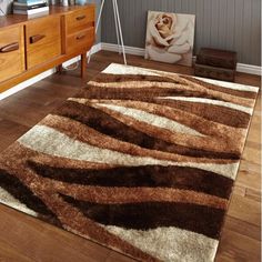 a brown and white area rug in a living room