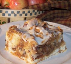 a slice of apple pie on a white plate