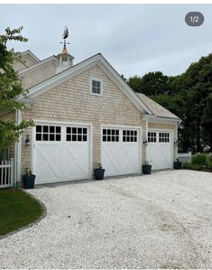 a two car garage is shown in front of a house