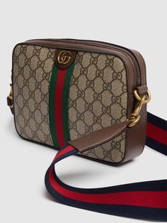 Height: 16cm Width: 23.5cm Depth: 4.5cm. Weight: 680g. Strap drop: 57cm. Adjustable strap. Top zip closure. Logo details. All over pattern placement may vary. Leather trim. Lined Gucci Ophidia, All Over Pattern, Sports Sweatshirts, Crossbody Messenger Bag, Work Bags, Strap Top, Sports Accessories, Toiletry Bags, Swim Accessories