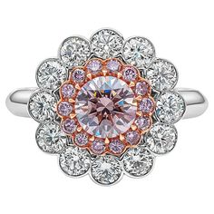 A rare and gorgeous ring, showcasing a vibrant 0.77 carat round brilliant cut diamond certified by GIA as Natural Fancy Pink color and SI1 clarity, set on a fourteen prong 18K rose gold basket. Surrounded by a halo of 14 bezel-set round cut pink diamonds and accented by round brilliant cut diamonds, set in a floral motif. Accent diamonds weigh 0.21 carat total and 1.18 carats total, respectively. Size 6.5 US, resizable upon request.  Roman Malakov is a custom house, specializing in creating anyt Luxury Pink Cluster Ring With Halo Design, Double Halo Engagement Ring, Double Halo Engagement, Pink Diamond Ring, Contemporary Engagement Rings, Platinum Diamond Engagement Rings, Fancy Yellow Diamond, Double Halo, Platinum Engagement Rings