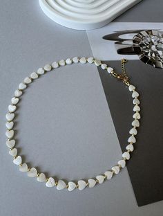 The mother-of-pearl necklace is available to order. Elegance begins with the details. Add this touch to your style with a necklace with mother-of-pearl hearts  ✔️ High-quality and anti-allergenic Japanese hardware ✔️ Jewel length: 36 cm + 5 cm extension chain The jewels are delivered in a gift box and in a storage case. . White Beaded Necklaces With Heart Charm As Gift, White Heart Necklace With Clavicle Chain As Gift, White Heart Beads Necklace As A Gift, White Heart Bead Necklace For Gift, White Heart Clavicle Chain Necklace As Gift, White Beaded Necklaces With Heart Pendant, White Beaded Necklace For Valentine's Day Gift, White Adjustable Necklace For Valentine's Day, White Delicate Heart Necklace For Mother's Day