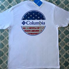 Columbia T-Shirt Nwt New With Tags! No Rips, Stains, Or Odors. Pet-Free & Smoke-Free Home! Feel Free To Ask Questions And Offers Are Welcome!! Bundle & Save New To Poshmark?? Use My Referral Code Moeclassics And You’ll Receive $10 Upon Joining!!! White Short Sleeve Tops Made In Usa, Casual White Tops Made In Usa, White Cotton Shirt Made In Usa, White Short Sleeve T-shirt With Flag Print, White Graphic Tee Made In Usa, White Summer T-shirt Made In Usa, White Tops Made In Usa For Summer, White Crew Neck T-shirt With Flag Print, White Casual Shirt With Flag Print