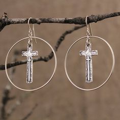 These large, yet lightweight earrings have a perfectly round circles that encase the dangling, symmetrical, cross with small raised cross toward the bottom. Measuring 1.5" wide and 1.5" long, they dangle from the plain shepherd hook wires.Solid Sterling Silver Jewelry, Unique Christian, Handmade in Texas by artist Shandon Camarillo-Whitson Hypoallergenic Cross Earrings, Nickel-free Cross-shaped Sterling Silver Earrings, Nickel Free Sterling Silver Cross Earrings, Nickel-free Sterling Silver Cross Earrings, Pierced Cross Sterling Silver Earrings, Sterling Silver Cross Earrings With Ear Wire, Elegant Cross Hoop Earrings Gift, Nickel-free Cross Hoop Earrings As Gift, Tahitian Pearl Bracelet