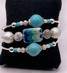 Unique Turquoise Beaded Bangle Bracelet, Turquoise Multi-strand Hand Wrapped Bracelets, Blue Adjustable Unique Cuff Bracelet, Adjustable Blue Wrap Bracelet, Unique Hand-wrapped Blue Cuff Bracelet, Turquoise Stackable Bangle Beaded Bracelets, Turquoise Multi-strand Hand Wrapped Jewelry, Unique Hand Wrapped Blue Cuff Bracelet, Turquoise Stackable Beaded Bangle Bracelets