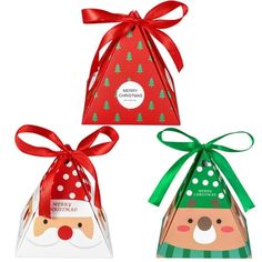 three christmas gift bags with santa's hats on them