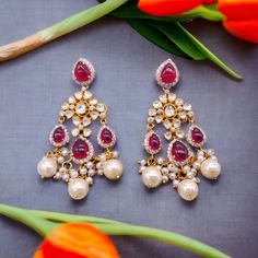 Silver Moissanite Polki Chandbali, Wedding Jewelery, Moissanite Polki Earring, Ruby Polki Earring, Ruby Earring, Wedding Jewellery, Chandbali *𝐀𝐛𝐨𝐮𝐭 𝐏𝐫𝐨𝐝𝐮𝐜𝐭* Product Code :-  TE 1014 Product Type :- Dangle Earring Product Weight :- 24.56 Gram Gemstone Used :- Moissanite, Labmade Ruby, Labmade Pearl Material :- 925 Starling Silver, Labmade Gemstones Size :- 6.5x2 Cm Intricate, hand-crafted, Pure Silver Polki Earrings, studded with high-quality Moissanite Polki comes with Push back, made in 92.5 silver with 22ct gold plating. The product comes with 92.5 silver stamping -Product can be made in gold as well. -If any product is not ready, It takes 2-3 weeks to make in pure silver -We also look forward to Bulk Orders. We shall consider special discount on Bulk Orders. Navrii (TM) by Festive Fusion Style Formal Chandelier Earrings, Fusion Style Kundan Bridal Earrings For Reception, Chandbali Bridal Earrings With Intricate Design, Traditional Dangle Pearl Earrings For Anniversary, Festive Pearl Drop Bridal Earrings For Reception, Formal Bridal Earrings With Pearl Drop For Festivals, Festive Bridal Earrings With Pearl Drop For Reception, Festive Bridal Pearl Drop Earrings For Reception, Formal Festive Bridal Earrings With Pearl Drop