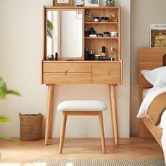 a bedroom scene with focus on the dressing table and stool, which has been placed in front of the bed