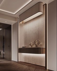 an empty room with wood flooring and white vases on the shelf in front of it