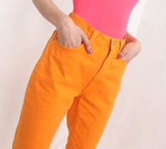 "vintage 90s bright orange high waist jeans> five pockets label> h&j \\ holiday&jeans material> cotton size> 46\\32 waist> 74cm\\ 29'' hips> 102cm\\ 40'' length> 103cm\\ 40'' inseam> 28cm\\ 11\" condition> great vintage condition> minimal wear | model is 174 cm [5'8\"] and measures 80-56-90 cm [31\"-22\"-35\"] |" Trendy High Rise Orange Bottoms, Casual Orange Summer Jeans, Retro High Waist Orange Pants, Retro Orange Bottoms With Pockets, Orange Straight Leg Summer Bottoms, Orange Straight Leg Bottoms For Summer, Spring Orange Jeans With Pockets, Orange Jeans For Spring, Retro High-waisted Orange Pants