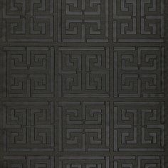 a black rug with an intricate design on it