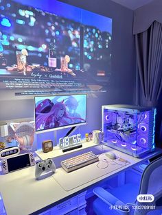 a computer desk with two monitors and a keyboard on it in front of a large screen