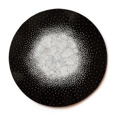 a black plate with white dots on it