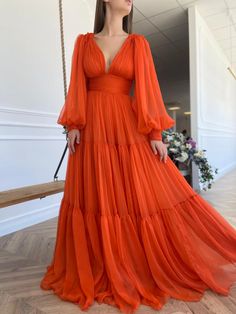 Details:-Designer silk fabric-Vivid orange color-A-line style with deep cleavage cusp and see through sleeves-For special occasions Teuta Matoshi, Orange Chiffon, Drape Gowns, Drape Maxi Dress, فستان سهرة, Ball Gowns Prom, Prom Dresses With Sleeves, Guest Dress, Prom Dresses Long With Sleeves