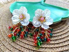 These bead embroidered large flowers earrings studs would make a perfect and unique gift for family, friend, or yourself ★READY TO SHIP Made with love and care about you!♥ ★DIMENSIONS: 7*4 cm (2.75*1.57 Inches) ★The colors can slightly differ from the photo because of photography lighting and monitor settings. ★ESTIMATED SHIPPING TIMES: North America: 2-4 weeks Europe: 1-3 weeks Australia, New Zealand and Oceania: 3-5 weeks Asia Pacific: 2-4 weeks Latin America and the Caribbean: 3-5 weeks North Handmade Festive Flower Earrings, White Beaded Flower Earrings For Party, Handmade Flower Shaped Earrings For Celebrations, Handmade Flower Earrings For Celebration, Flower-shaped Earrings With Colorful Beads For Party, Colorful Beaded Flower Earrings For Party, Handmade Flower-shaped Beaded Earrings For Party, Party Flower Earrings With Colorful Beads, Flower Shaped Earrings With Colorful Beads For Party