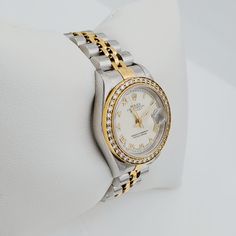 Women's Rolex 18K Gold Two-Tone 26mm DateJust Watch with Off-White Dial, Roman Numerals and Diamond Bezel. Pre-Owned SN# U62**** Brand: Rolex. Crystal: Sapphire. Gender: Women's. Bezel: Diamond Bezel. Dial Color: Off-White. Movement: Self-Winding. Case Dimensions: 26mm. Metal Type: Stainless Steel / 18K Yellow Gold. Bracelet / Strap: Jubilee 18K Gold / Stainless Steel. Box / Certificate: Rolex Box / Certificate of Authenticity. Service Warranty: One (1) Year Limited Service Warranty. Formal Jubilee Bracelet Watch Accessory, White Gold Watch Accessories For Anniversary, Classic White Watch With Jubilee Bracelet, Classic White Watches With Jubilee Bracelet, Classic White Diamond Watch With Brilliant Cut, Gold Watch Bands With Diamond Hour Markers, Elegant Watch Bands For Formal Occasions, Timeless White Jewelry And Watches For Anniversary, Yellow Gold Diamond Watch For Formal Occasions