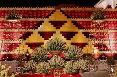 an elaborately decorated stage with potted plants