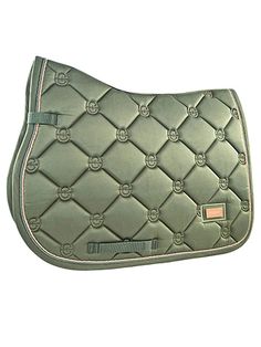 a green saddle pad with pink piping