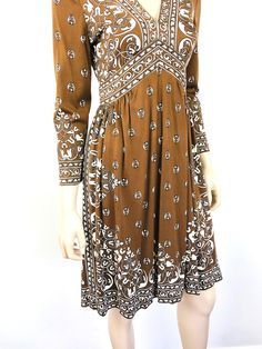 "Vintage 1970s Brown & White Dress - V neckline - zips at back - pucci style graphic print - brown & white color - jersey type material Great vintage condition. size - S 36\" bust 26\" waist full hip 38\" length 21\" sleeve US sales/shipping only. All sales are final / as-is. We do not accept returns." 1970s Fitted Brown Dress, Fitted Brown 1970s Dress, Fitted Brown 1970s Style Dresses, Vintage Printed Brown Dress, Vintage Brown Printed Dress, Brown Vintage Printed Dress, Retro Brown V-neck Dress, Vintage Pucci, Pucci Vintage