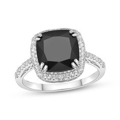 Big and bold, this gemstone ring makes a fashion statement. Created in sterling silver, this ring showcases a faceted cushion-cut black onyx wrapped in a frame of round white lab-created sapphires. More lab-created sapphires decorate the ring’s slender shank for a sparkling finish. Pearl Diamond Jewelry, Black Cushion, Cross Jewelry Necklace, Fan Jewelry, Cushion Halo, Tennis Bracelet Diamond, Ring Style, Sapphire Stone, Gold Diamond Rings