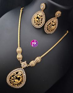 Peacock Premium Matte gold finish AD stone necklace with matching Big Earrings - Traditional Jewelry - Mk Fashionkart Earrings: Matching Earrings Material: premium polish, Matte gold finish, AD stones Suitable for Saree/Salwar/party wear dresses Adjustable length    SHIPPING : Ready to ship in 1 business day. This item will be shipped from The United States. Jewelry care instructions : 1. Please wipe the jewelry with a piece of cotton cloth after usage.  2. Store the jewelry in a cool, dry and air tight box or pouch.  3. Make sure the jewelry is away from direct heat and water. 4. Please wipe of any moisture, sweat, soap water after usage. Gold Sets With Peacock Design For Festive Season, Festive Gold Sets With Peacock Design, Gold Temple Jewelry Set With Peacock Design, Elegant Gold Set With Peacock Design, Elegant Gold Sets With Peacock Design, Formal Gold Necklace With Peacock Design, Elegant Gold Necklace With Peacock Design, Gold Kundan Jewelry Set With Peacock Design, Elegant Gold Kundan Necklace With Peacock Design