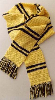 a yellow scarf with black and white stripes