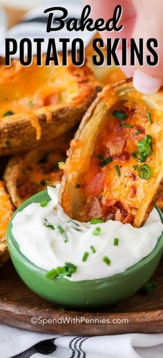 baked potato skins in a bowl with sour cream on the side and text overlay that reads baked potato skins