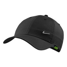 the nike golf cap is black and has a green logo on it, while the visor