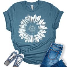 Style: Add some style to your wardrobe with our fall clothes for women! These graphic tees for women are the perfect blend of style and comfort and are sure to add some fun and fashion to your attire. Quality: Our womens tops are designed and printed with love in the USA. We use high-quality inks on premium Bella Canvas unisex fall shirts for women for a bold and stylish look. Perfect Fit: Our fall outfits for women come in a variety of sizes so you can find the perfect fit! Our womens fall clothes come in sizes from XS - 4XL so everyone in the family can join in the fun! We do not pre-tie or roll our shirts. We leave that up to your style. Great Gift Idea: Our fall shirt is the perfect gift for anyone in your life. Whether it's for a birthday, or just because, these ladies tops are a fun Sunflower T Shirt, Sunflower Tshirt, Plus Size Summer Tops, Graphic Tees For Women, Summer Graphic Tee, Sunflower Shirt, Plus Size Tees, Womens Tops Summer, Plus Size Summer