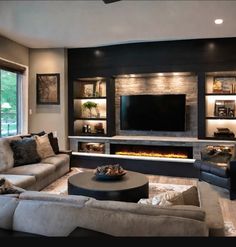 a living room filled with furniture and a flat screen tv mounted on the wall above a fire place