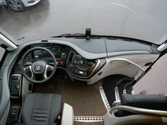 the interior of a car with its dashboard and steering wheel down, viewed from above