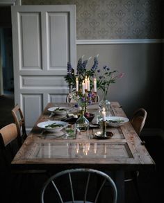 the instagram page shows an image of a table with candles and flowers on it