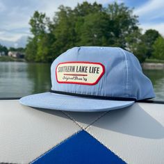 Expertly crafted: SLL PATCH SKY BLUE ROPE HAT is a durable and comfortable cotton/poly blend with a plastic snapback for an adjustable fit. With UPF 50+ and water repellent properties, this hat protects from the sun and water while showcasing the OG SLL PATCH design.   * Cotton/Poly Blend *  Plastic Snapback * UPF 50+ * Water Repellent Blue 5-panel Hat For Outdoor Activities, Blue Curved Brim Baseball Cap For Travel, Travel Blue Curved Brim Baseball Cap, Blue Cotton Fitted Hat With Flat Brim, Blue 5-panel Travel Hat, Blue Cotton Sun Hat For Outdoor Use, Blue Cotton Sun Hat For Outdoor, Adjustable Blue Baseball Cap For Travel, Blue Cotton 5-panel Snapback Hat