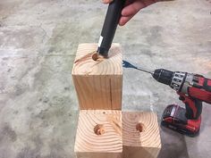 a man is using a drill to cut wood pieces with a cordless drilldrive