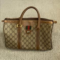 Authentic Gucci Vintage Gg Logo Web Boston Bag Item Condition: From A Well Loved Home. Handles And Other Areas Of Handbag Are Pretty Worn And Inner Pocket Has A Stain. Please See Photos! If You Would Like Additional Photos, Please Request In Comments. Approximate Dimensions: Height: 6.2", Length: 10.6", Depth: 5.1", Drop: 4.3" Made In Italy Code: 40.02.007 Gucci Rectangular Satchel With Branded Hardware, Gucci Brown Satchel Bag, Gucci Brown Shoulder Bag Satchel, Gucci Classic Satchel With Branded Hardware, Classic Gucci Satchel With Branded Hardware, Gucci Bag With Branded Hardware And Double Handle, Gucci Brown Satchel With Top Carry Handle, Gucci Brown Top Handle Satchel, Brown Gucci Satchel With Top Carry Handle