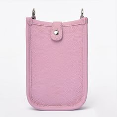 The crossbody phone bag is crafted from genuine cowhide top grain leather (togo), setting a high standard for style and durability. Perfect for those who appreciate the elegance of simplicity, this bag boasts an easy-access design with 3 card slots at the back. The open interior, secured by a top button closure, provides a safe and convenient space for your essentials. The strap, made from the same superior leather, is adjustable to suit your comfort and style.The bag is available in five captiv Crossbody Phone Bag, Togo Leather, Mini Crossbody Bag, Mini Crossbody, Top Grain Leather, Phone Bag, Dusty Pink, Summer Collection, Easy Access