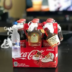 a coca - cola box with six bottles in it