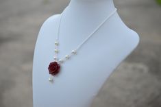 "Featuring 25mm Hand Sculpted Deep Red (Garnet) Rose and pearls Centered Necklace. Matching Red Rose Earrings: https://www.etsy.com/listing/165095225/red-rose-and-pearls-earrings-dangle-rose?ref=shop_home_active Note : Drop a note if you prefer Fired red rose or Succulent Rose, otherwise will be shipped as Garnet Red Rose. Material and size : Rose Clay Flower is approximately 25-26mm across. 6-8mm Ivory /cream/Off-white glass pearls. White pearls available. Swarovski available with additional co Formal Red Flower Necklace, Red Rose Design Necklace For Wedding, Elegant Rose Red Necklace For Wedding, Elegant Rose Red Wedding Necklace, Red Rose Design Jewelry For Wedding, Red Rose Design Wedding Jewelry, Red Rose Jewelry, Jordan Gift, Red Rose Earrings