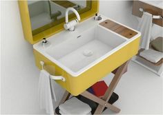 a bathroom with a yellow sink and mirror