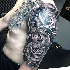 a man's half sleeve with roses and compass tattoo on his left upper arm