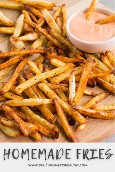 homemade fries on a cutting board with dip in the middle and text overlay that reads homemade fries