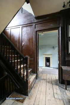 an old wooden staircase leading up to the second floor