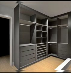 an empty walk in closet with lots of drawers