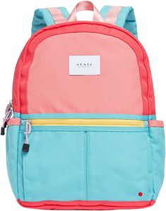 a pink and blue backpack with two zippers on the front, one has a name tag